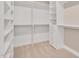 Spacious walk-in closet with custom shelving, drawers, and plenty of storage space at 715 White Oak Pond Rd, Apex, NC 27523