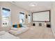 Media room featuring two daybeds, a large projector screen, and bright windows at 715 White Oak Pond Rd, Apex, NC 27523