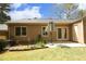 The backyard features a patio, lush lawn, and well-maintained landscaping at 716 Red Forest Trl, Raleigh, NC 27615