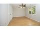 An empty bedroom features hardwood floors, white trim, neutral paint, and a ceiling fan at 716 Red Forest Trl, Raleigh, NC 27615