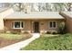 Charming home featuring a neutral exterior, manicured landscaping, and a welcoming front entrance at 716 Red Forest Trl, Raleigh, NC 27615