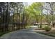 Picturesque street view showcasing the peaceful, tree-lined neighborhood at 716 Red Forest Trl, Raleigh, NC 27615
