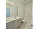 Well-lit bathroom features double sinks, a quartz countertop, and a shower-tub combination at 75 Furley St., Homesite 115, Sanford, NC 27330