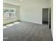 Spacious bedroom featuring plush carpet and a large window at 75 Furley St., Homesite 115, Sanford, NC 27330