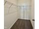 Walk-in closet with carpeted flooring and wire shelves at 75 Furley St., Homesite 115, Sanford, NC 27330