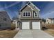 New two-story home with a two-car garage and a concrete driveway at 75 Furley St., Homesite 115, Sanford, NC 27330