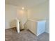 Second floor hallway with carpeted floor and stairway at 75 Furley St., Homesite 115, Sanford, NC 27330