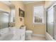 Clean bathroom featuring a white vanity, toilet, and shower with glass doors at 805 Lee St, Gibsonville, NC 27249