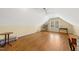 Large bonus room with hardwood floors, neutral walls, and natural light at 805 Lee St, Gibsonville, NC 27249
