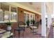 Inviting covered porch features comfortable seating, brick flooring, and provides an ideal spot for outdoor relaxation at 805 Lee St, Gibsonville, NC 27249