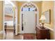 Bright foyer features arched doorway, wood floors, and elegant decor at 805 Lee St, Gibsonville, NC 27249