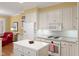 This kitchen is equipped with an island, built-in oven, and range at 805 Lee St, Gibsonville, NC 27249