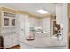 Modern kitchen features granite countertops, an island, and white cabinets with stainless appliances at 805 Lee St, Gibsonville, NC 27249