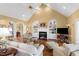 Bright living room with fireplace, vaulted ceilings, and seamless flow to other spaces at 805 Lee St, Gibsonville, NC 27249