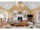 Open-concept living room featuring fireplace, built-in shelves, and inviting seating at 805 Lee St, Gibsonville, NC 27249
