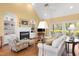 Spacious living room with vaulted ceiling, built-in shelving, and cozy fireplace at 805 Lee St, Gibsonville, NC 27249