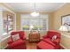 Cozy sitting area with comfortable chairs and a view of the outdoors at 805 Lee St, Gibsonville, NC 27249