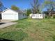 Large backyard with a detached garage and a shed, perfect for outdoor activities at 807 Everett St, Burlington, NC 27215