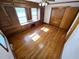 Bedroom showcasing hardwood floors, built-in storage with desk, and overhead fan for comfort and convenience at 807 Everett St, Burlington, NC 27215