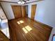 Bedroom featuring hardwood floors, closet space, and windows, creating a cozy and inviting atmosphere at 807 Everett St, Burlington, NC 27215