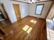 Bright bedroom with wooden floors, a ceiling fan, and a closet, offering a comfortable living space at 807 Everett St, Burlington, NC 27215