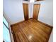 Bright bedroom with hardwood floors, natural light from window, and paneled doors at 807 Everett St, Burlington, NC 27215
