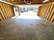 Spacious garage with concrete floor and exposed wood framing, ready for parking vehicles at 807 Everett St, Burlington, NC 27215