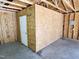 Garage interior featuring an enclosed room with a door, providing extra storage at 807 Everett St, Burlington, NC 27215