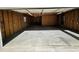 Large garage with concrete floor, exposed beams, and ample space for storage or projects at 807 Everett St, Burlington, NC 27215