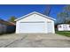 Detached, white one-car garage featuring a side entry door at 807 Everett St, Burlington, NC 27215