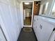 Hallway with multiple closets, leading to a sunroom, and providing ample storage space at 807 Everett St, Burlington, NC 27215
