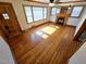 Bright living room featuring hardwood floors, a fireplace, and a ceiling fan at 807 Everett St, Burlington, NC 27215