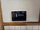 Smart thermostat on a wall controlling the weather settings for the home at 807 Everett St, Burlington, NC 27215