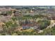 Stunning aerial view of modern home nestled in a lush, wooded landscape with driveway and ample parking at 90 Ferncrest Ct, Roxboro, NC 27574