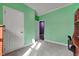 Bedroom featuring green walls and plush carpeting with a view into the closet at 90 Ferncrest Ct, Roxboro, NC 27574