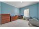 Bedroom featuring a crib, dresser, neutral paint and carpet flooring at 90 Ferncrest Ct, Roxboro, NC 27574