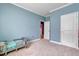 Comfortable bedroom featuring neutral carpet, sky-blue walls and white trim at 90 Ferncrest Ct, Roxboro, NC 27574