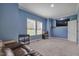 Spacious Bonus room with carpet flooring, natural lighting, and a mounted television at 90 Ferncrest Ct, Roxboro, NC 27574