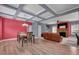 Open floor plan showcasing coffered ceilings, wood floors, stone fireplace, and a dining area adjacent to living area at 90 Ferncrest Ct, Roxboro, NC 27574