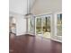 Bright dining room with hardwood floors, large windows, and deck access at 908 Snow Hill Rd, Durham, NC 27712