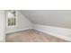 Small attic with carpet and dormer window at 924 Elbridge Dr, Raleigh, NC 27603