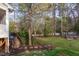 Spacious backyard features a wooden deck and a garden bed at 924 Elbridge Dr, Raleigh, NC 27603
