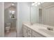 Bright bathroom featuring double sink vanity and a window at 924 Elbridge Dr, Raleigh, NC 27603