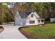 Beautiful two-story home with a spacious driveway, lush green lawn, and inviting front porch at 924 Elbridge Dr, Raleigh, NC 27603