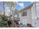 Large home exterior boasts a deck, many windows, and a two car garage at 924 Elbridge Dr, Raleigh, NC 27603