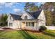 Stunning two-story home with a well-maintained lawn and a charming front porch at 924 Elbridge Dr, Raleigh, NC 27603