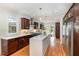 Bright and modern kitchen featuring stainless steel appliances, a spacious island, and stylish fixtures at 924 Elbridge Dr, Raleigh, NC 27603
