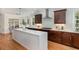 Spacious kitchen with a center island, stainless steel appliances, and dark wood cabinets at 924 Elbridge Dr, Raleigh, NC 27603