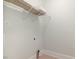 Simple laundry room with tile floors, minimal shelving and utility hookups at 924 Elbridge Dr, Raleigh, NC 27603
