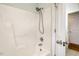 Clean white shower with updated fixtures and door to bathroom at 924 Elbridge Dr, Raleigh, NC 27603